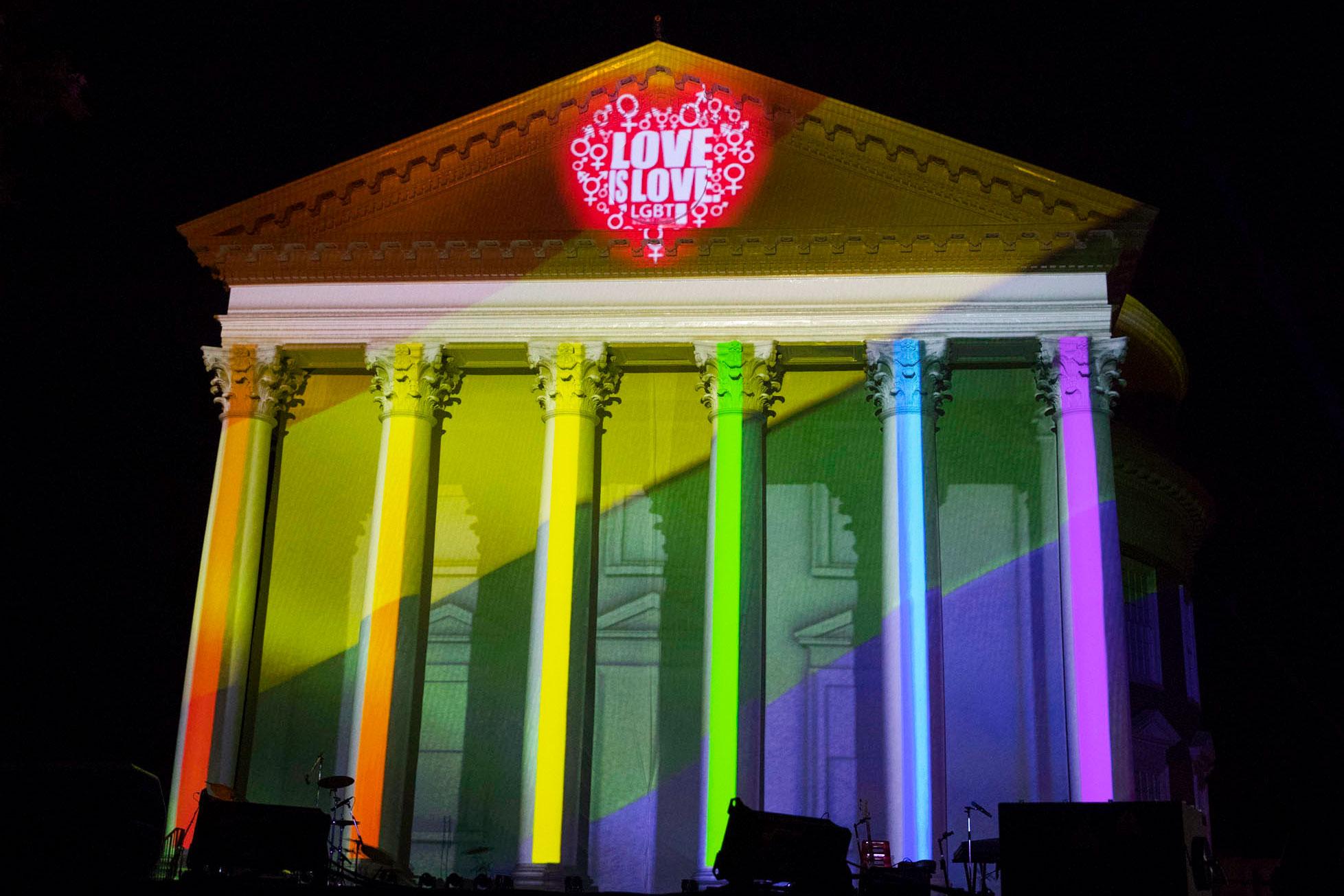 UVA Rotunda columns in colors of the rainbow with "Love is Love" projected.